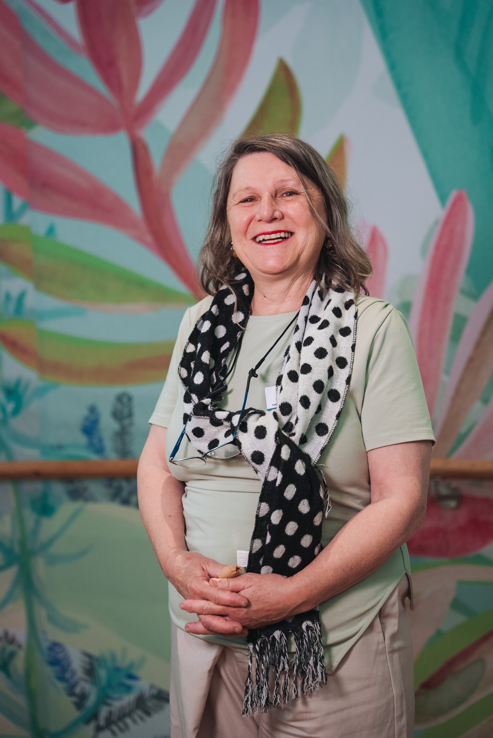 A person wearing a polka dot scarf.