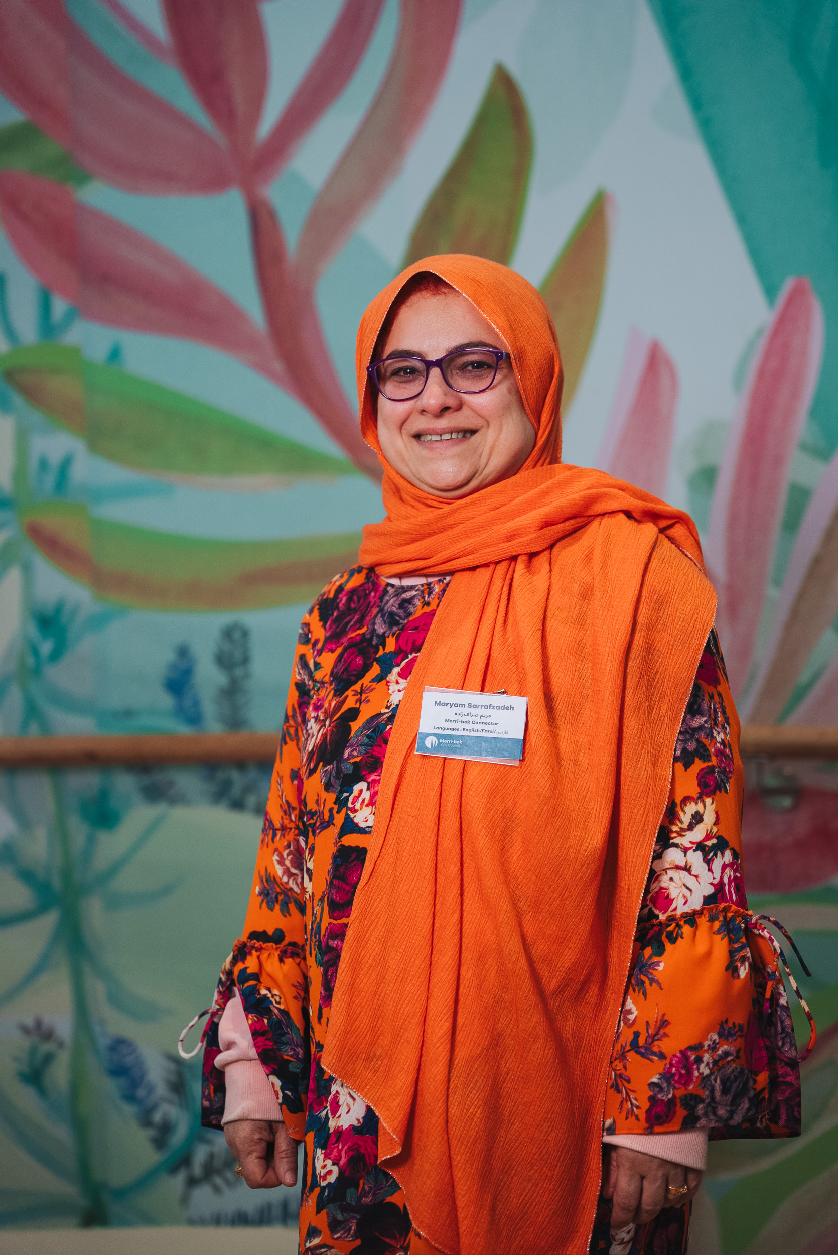 A person wearing a orange hijab.