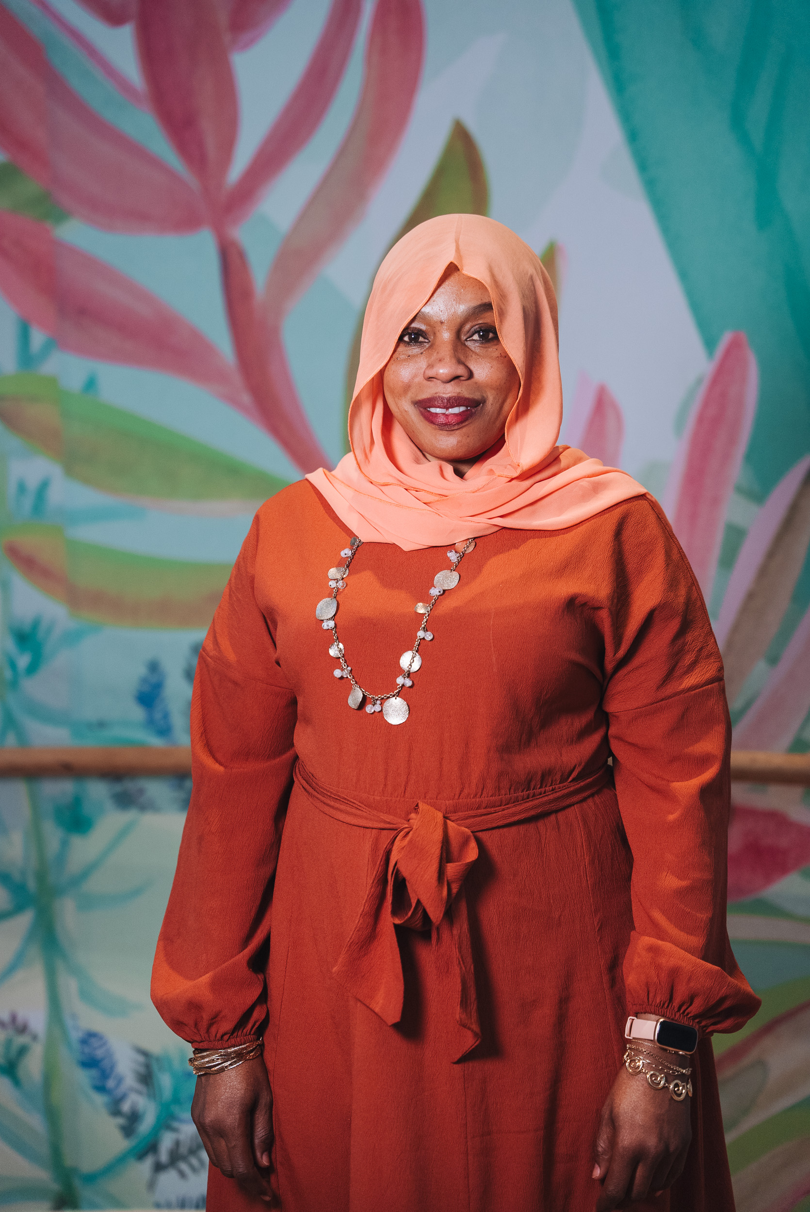 A person wearing a hijab and suit