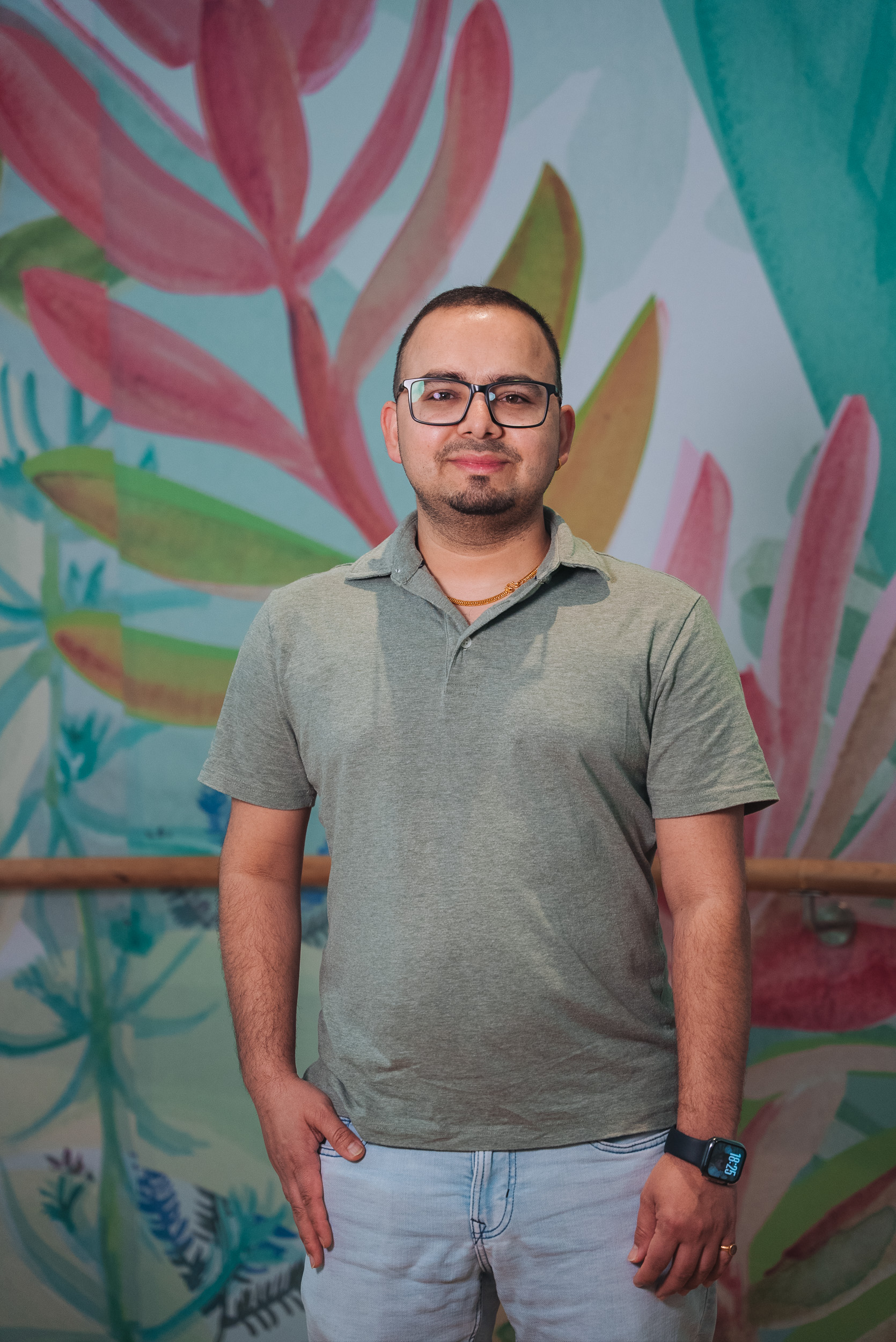 A person wearing a light green t-shirt