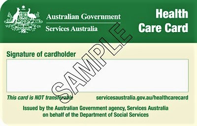 A Greens and Yellow Australian Government, Services Australia, Health Care Card with Sample stamped across the signature box.